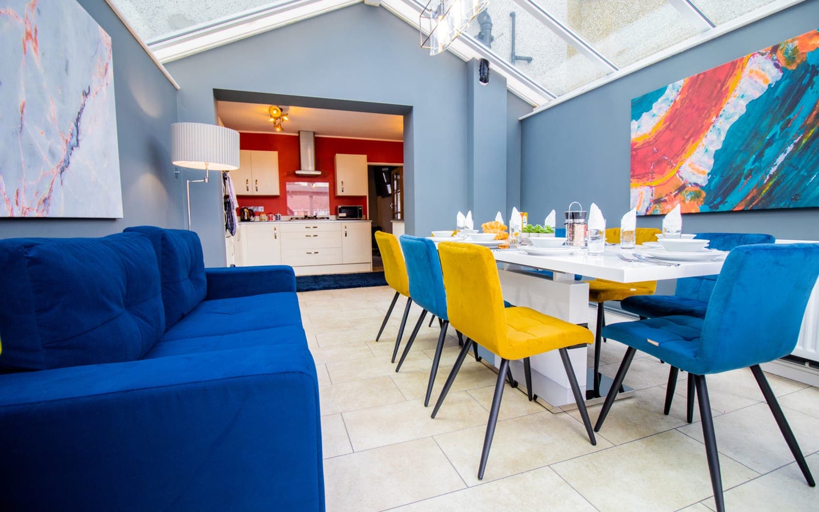 Conservatory dining room laid for nine guests at Stroud Road, Bristol