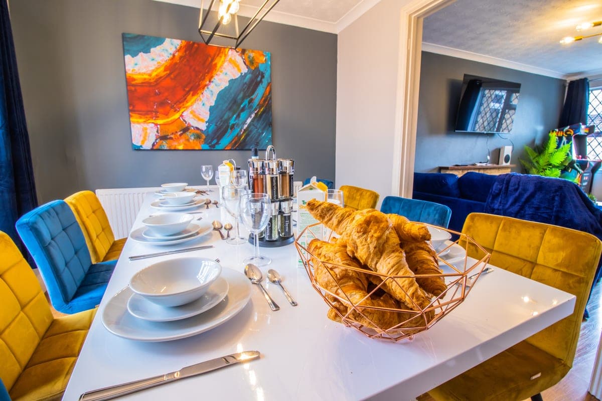 Dining table laid with breakfast for guests