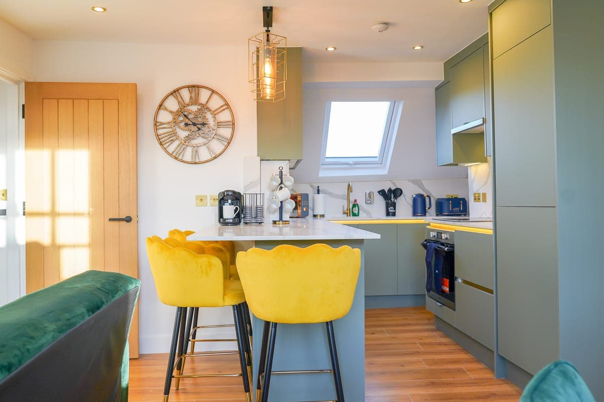Open-plan living and kitchen space with vaulted ceilings