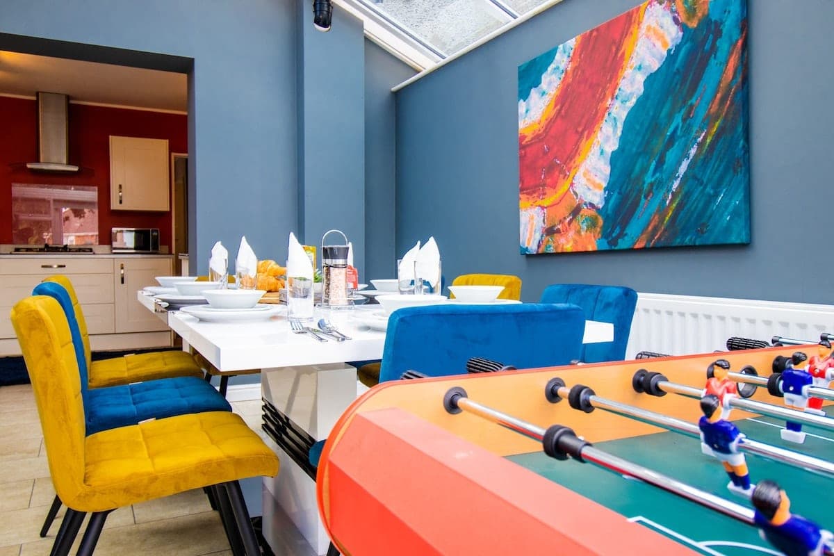 Dining area with a table football game